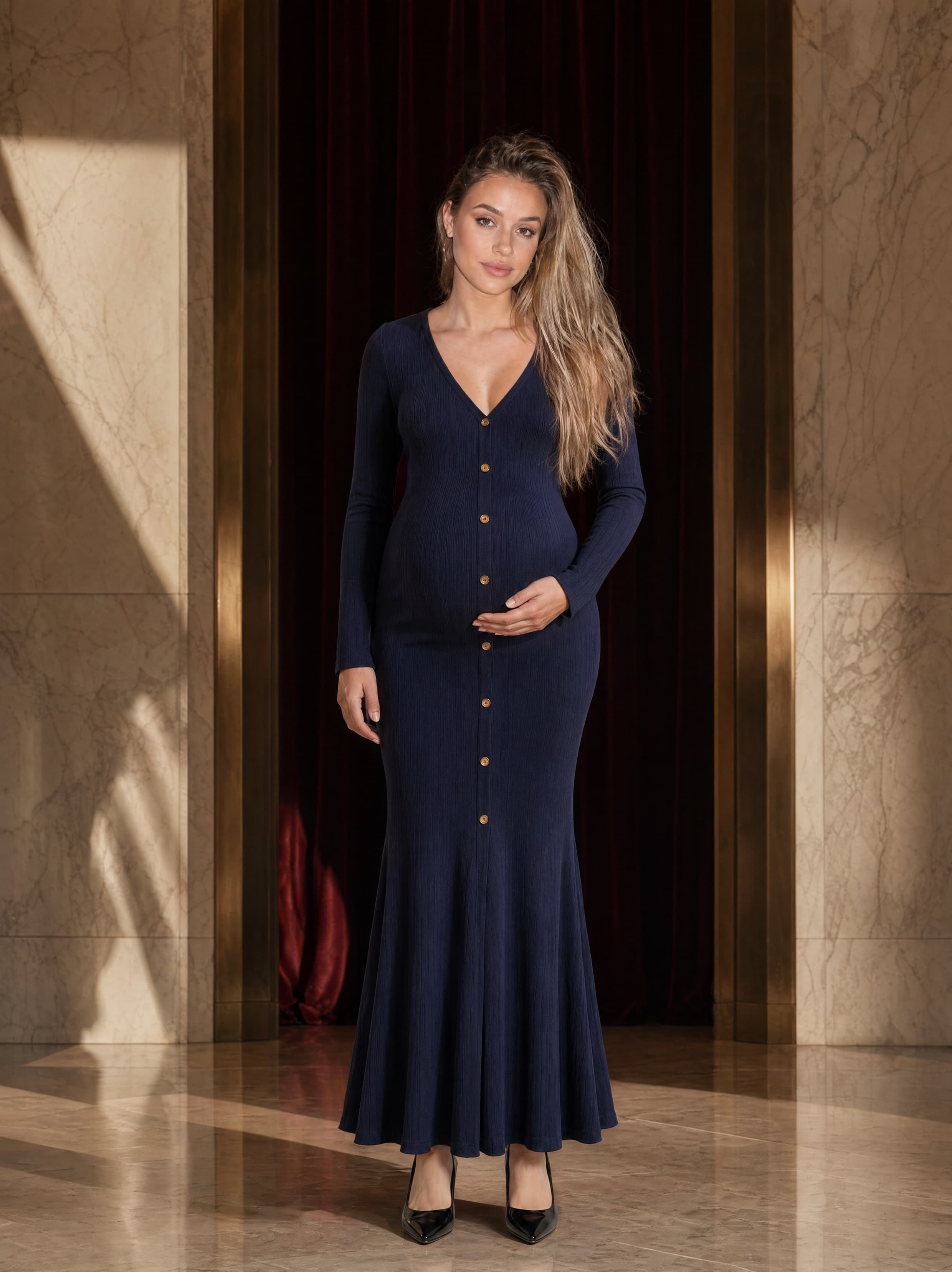Editorial portrait for Visible Form in a black column dress with directional light.